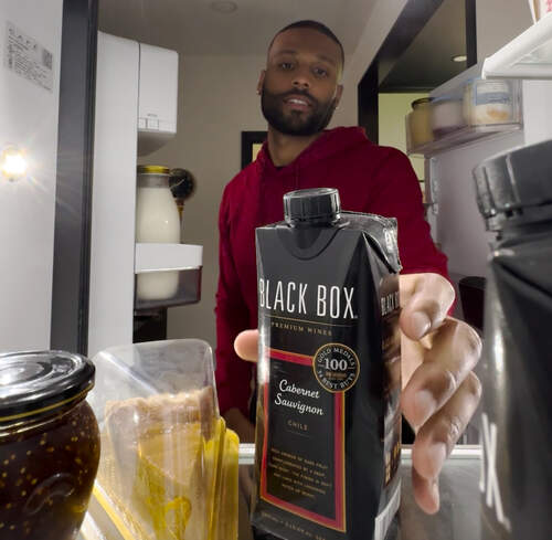 How do I store my boxed wine after opening?